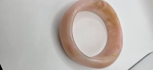 Vintage translucent pink and beige marbled bangle bracelet.